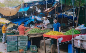 A group of local farmers proudly displaying their fresh produce at a community market in Jatobá dos Noletos.