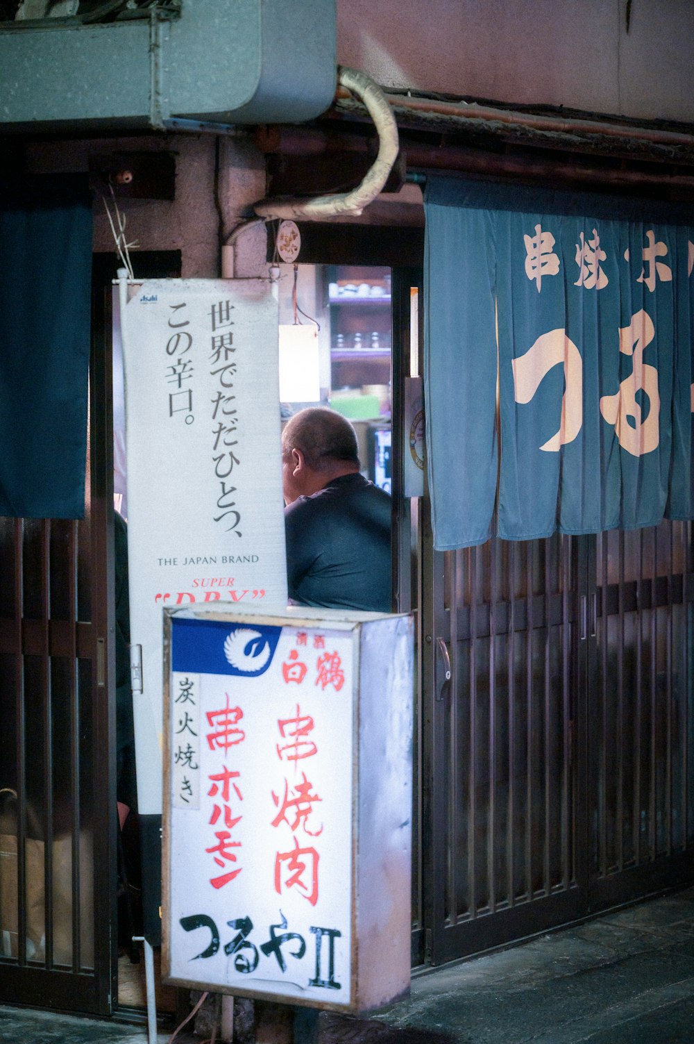 a man sitting in a doorway of a building