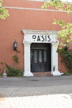 Front view of the Oasis Audit Solutions office building with clear signage.