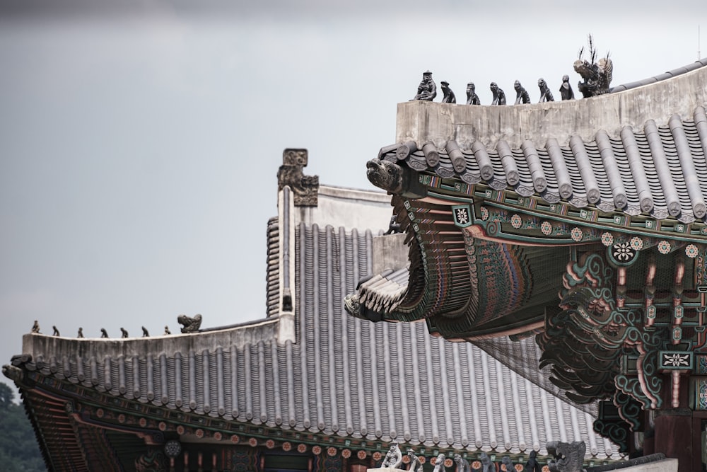 the roof of a building with birds perched on top of it