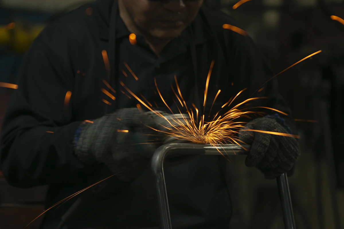 A blacksmith striking glowing iron, Ogum of iron and the path