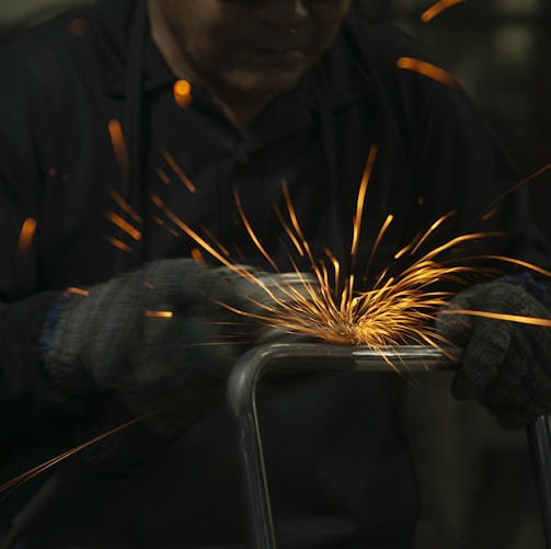 a man working on a piece of metal