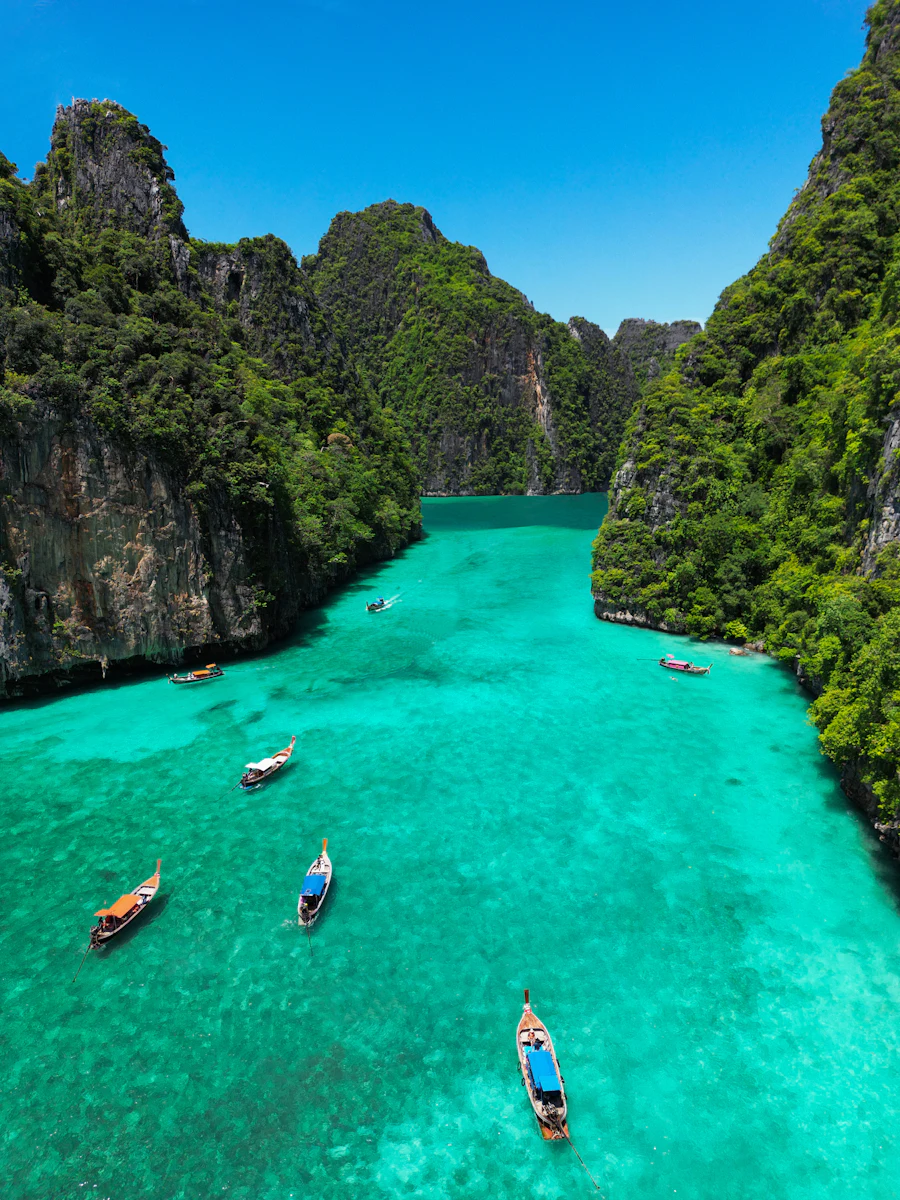 Turquoise lagoon ringed by limestone cliffs in the Andaman sea