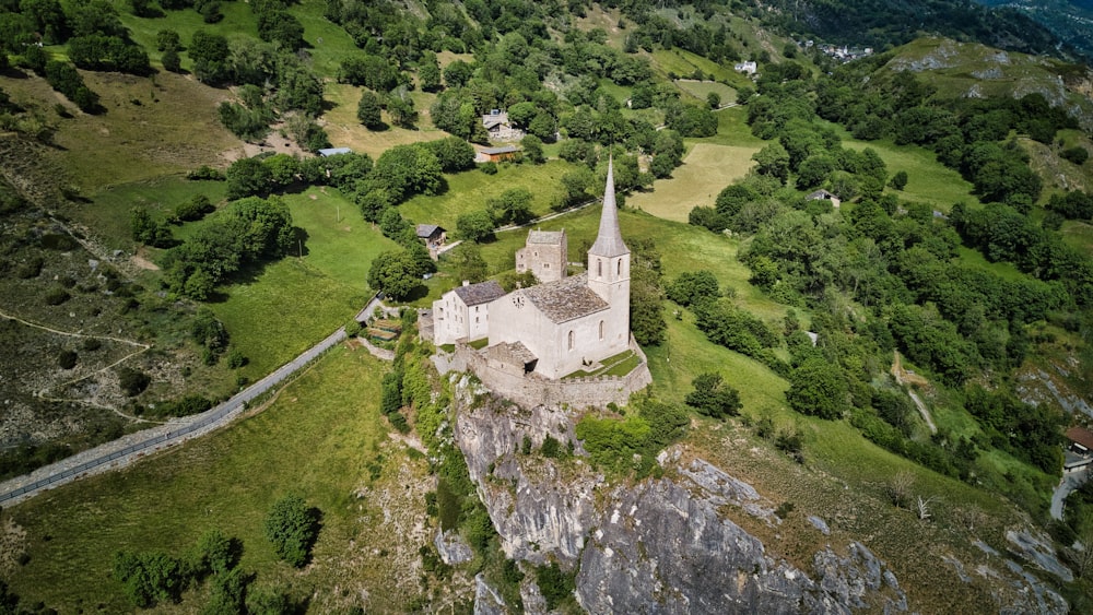 an aerial view of an old church in the mountains