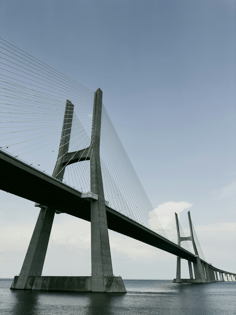 a large bridge spanning over a large body of water