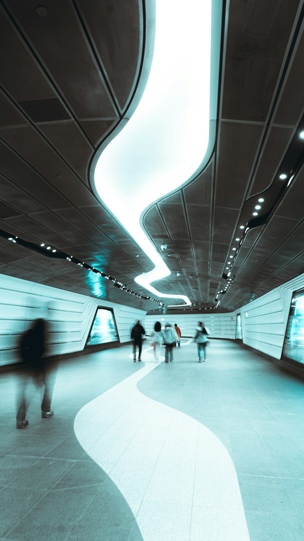 a group of people walking through a tunnel