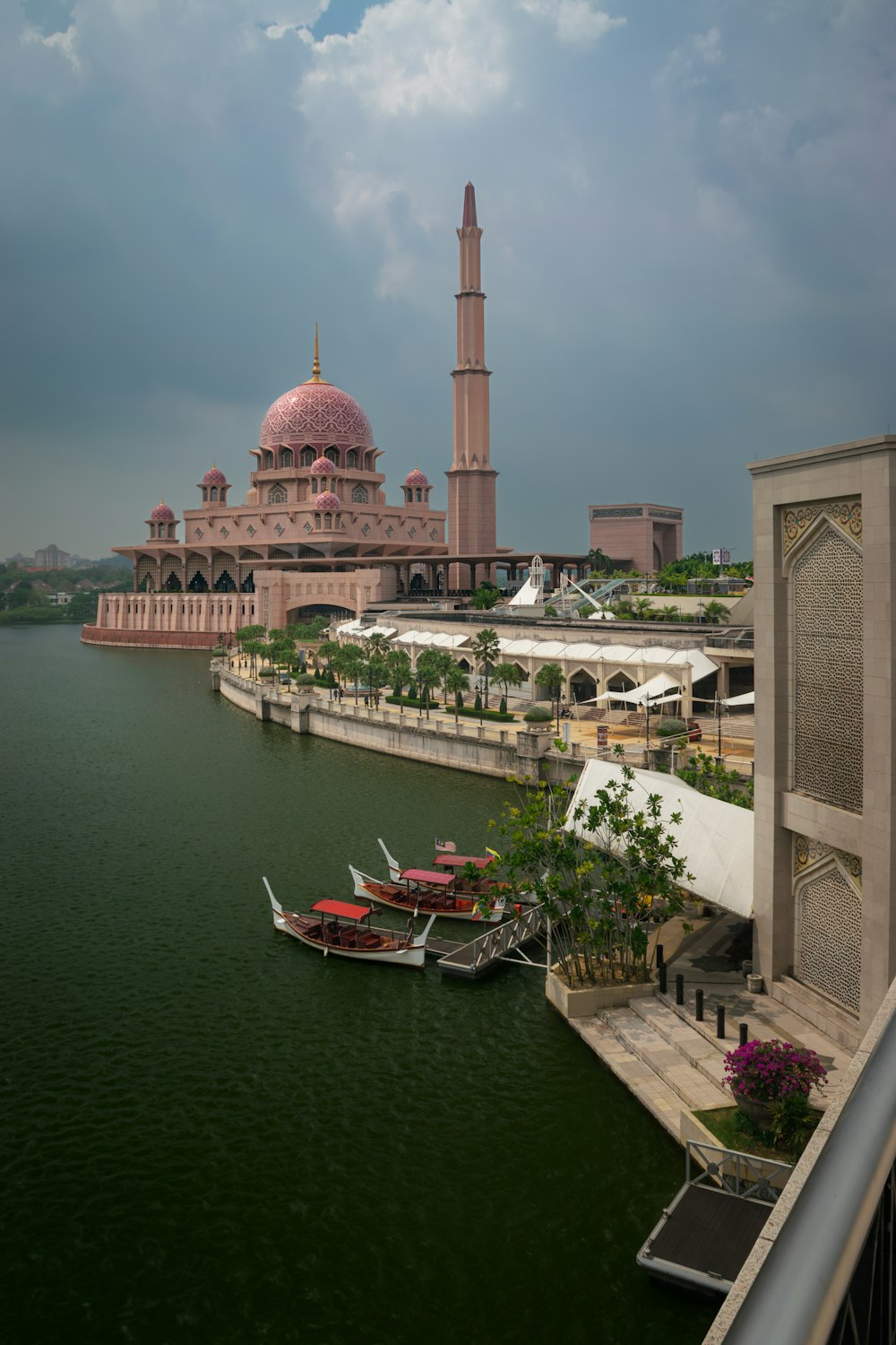 a large building sitting next to a body of water