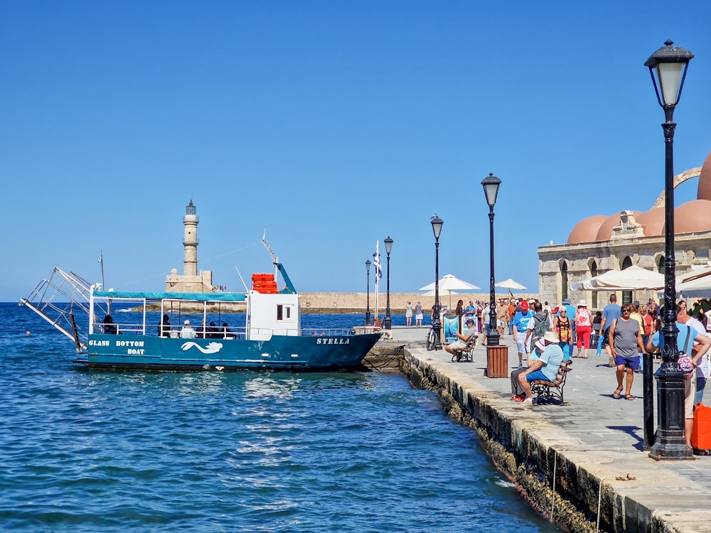 a boat is docked in the water near a pier