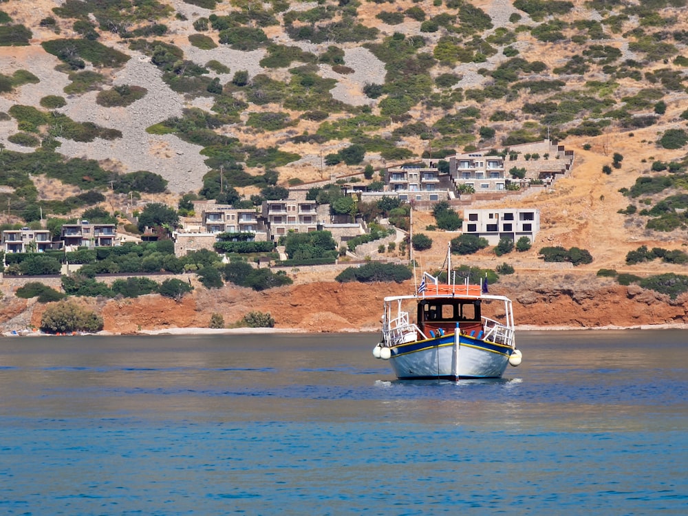 a boat floating on top of a large body of water