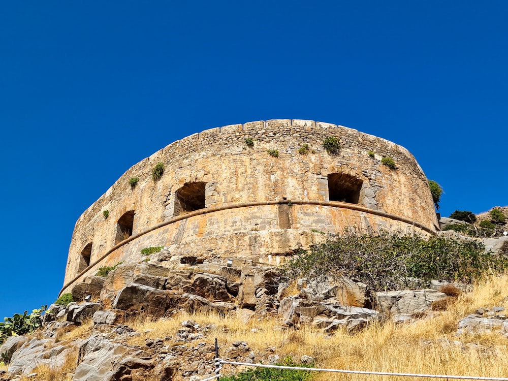 a stone structure on top of a hill