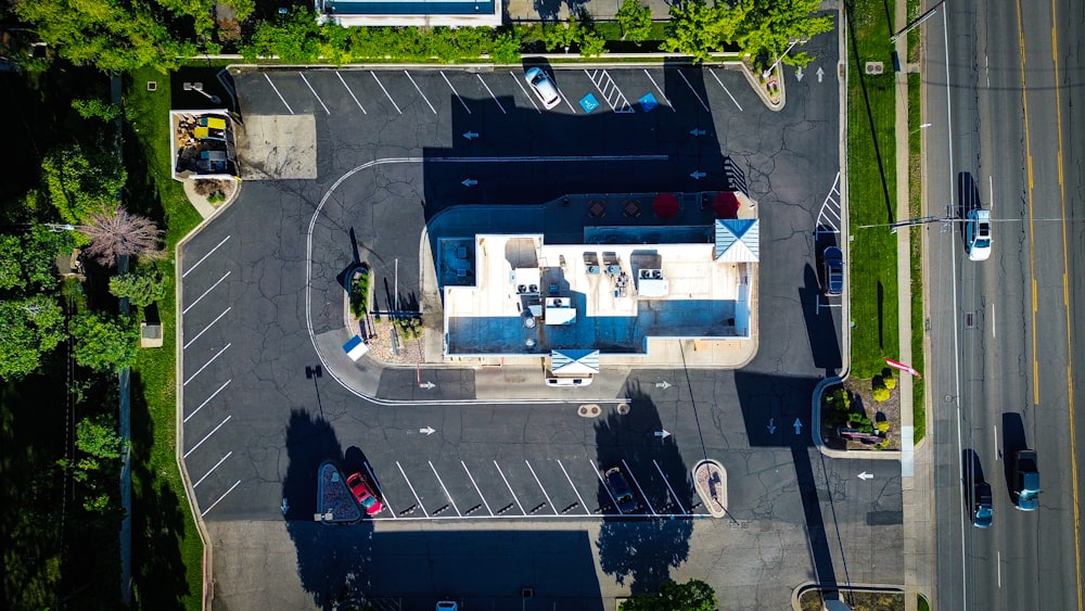 an aerial view of a parking lot with a gas station