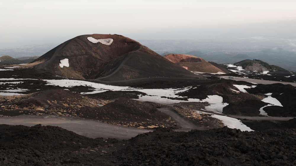 a group of mountains with snow on them