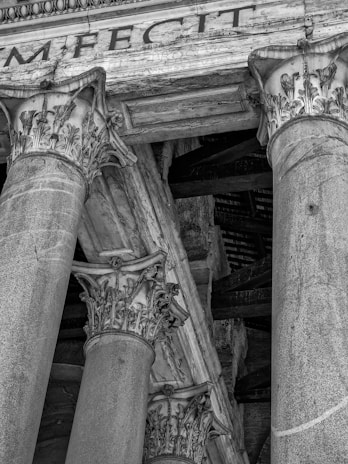 Close-up of a Roman column detail featured in the store logo.
