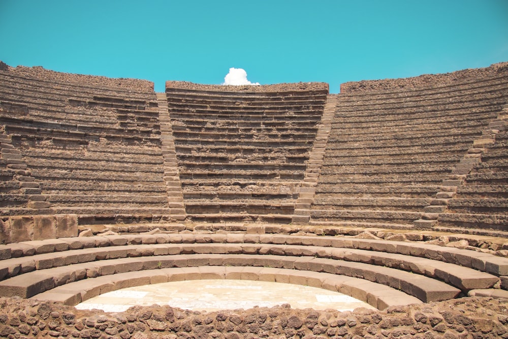 a large stone structure with a sky in the background