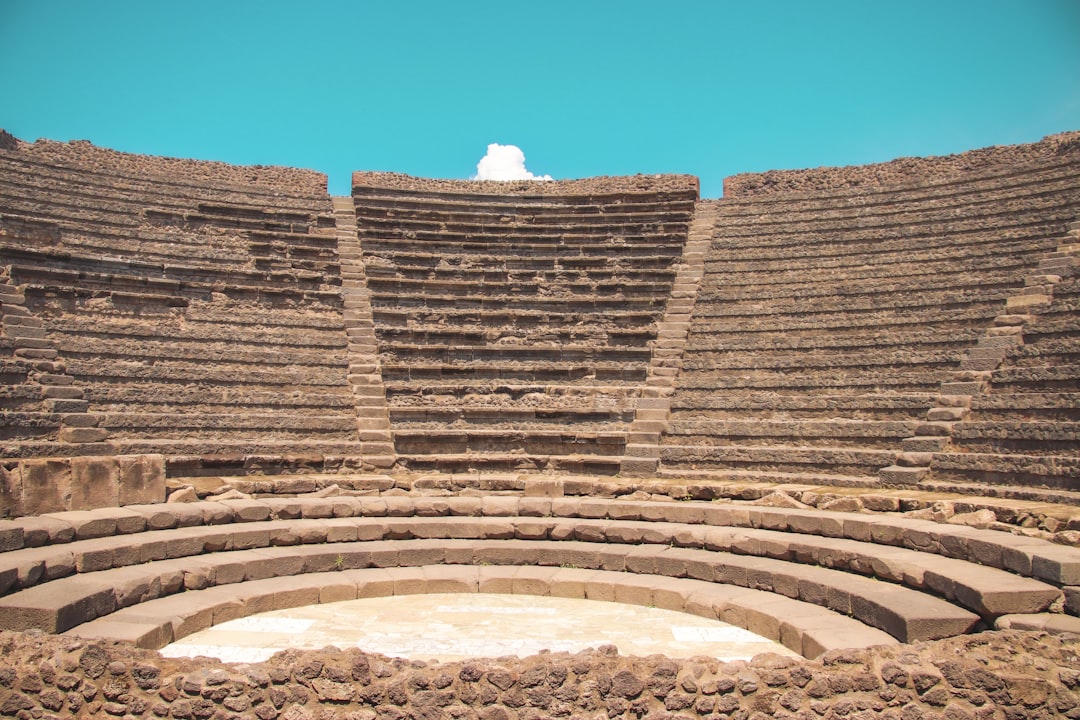 a large stone structure with a sky in the background,