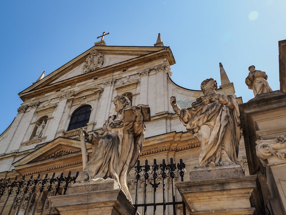 a building with statues on the front of it