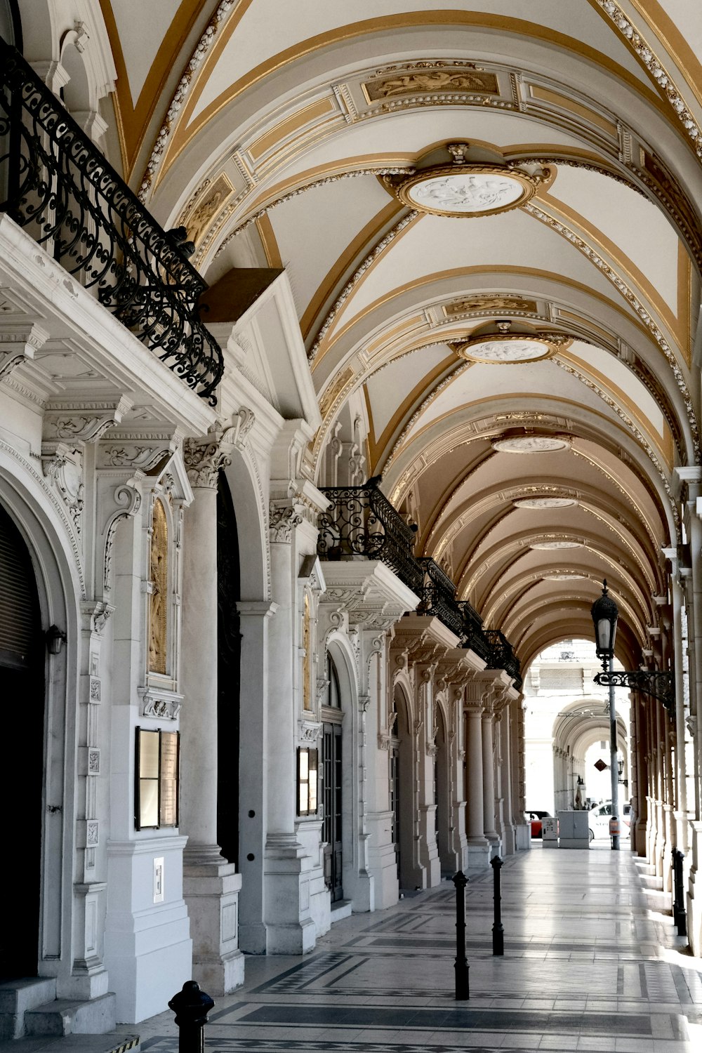 a long hallway with a clock hanging from the ceiling