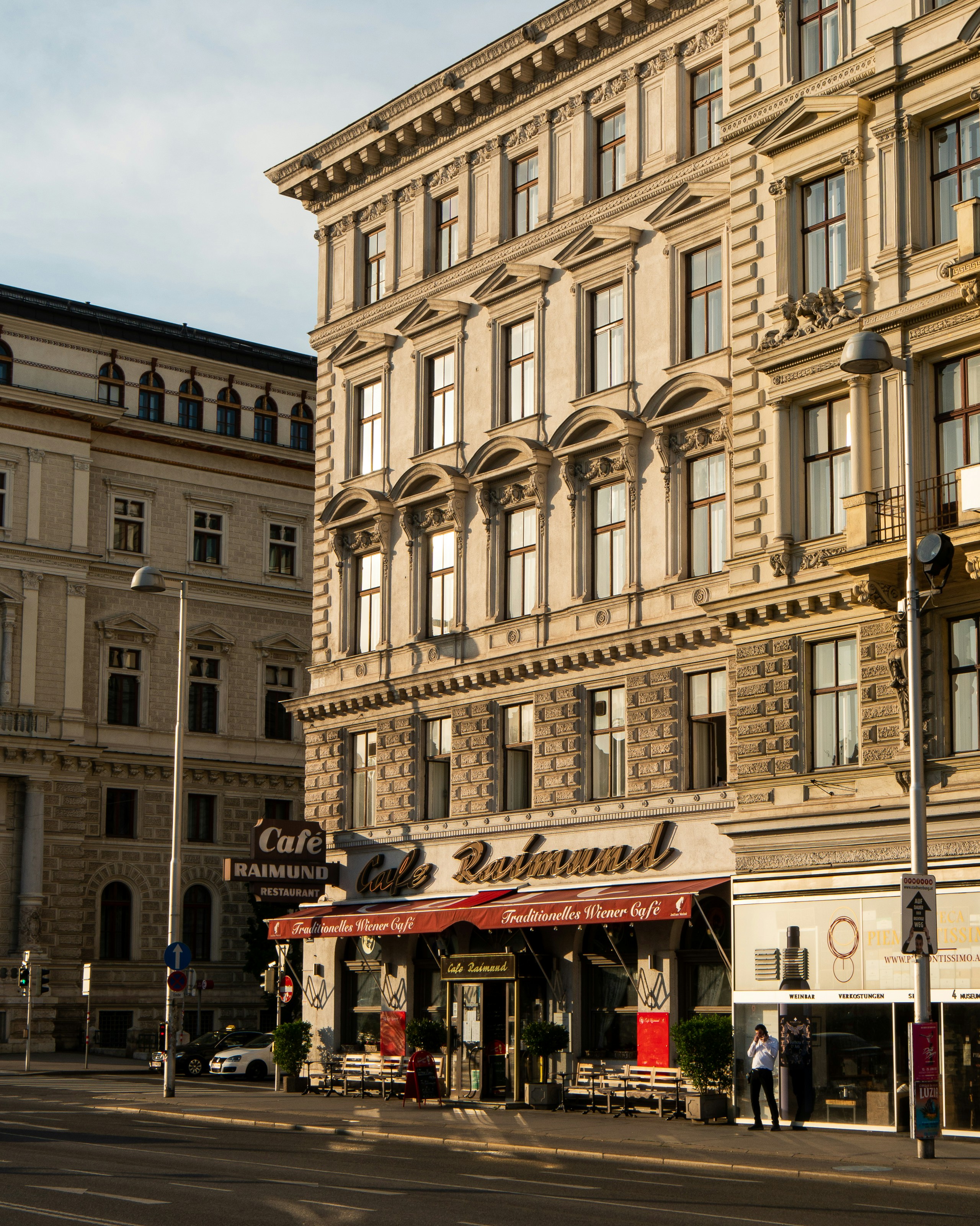 a street corner with a building in the background