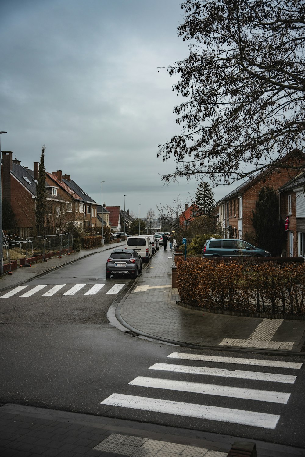 a street with cars parked on the side of it