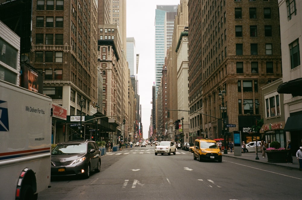 a city street filled with lots of tall buildings