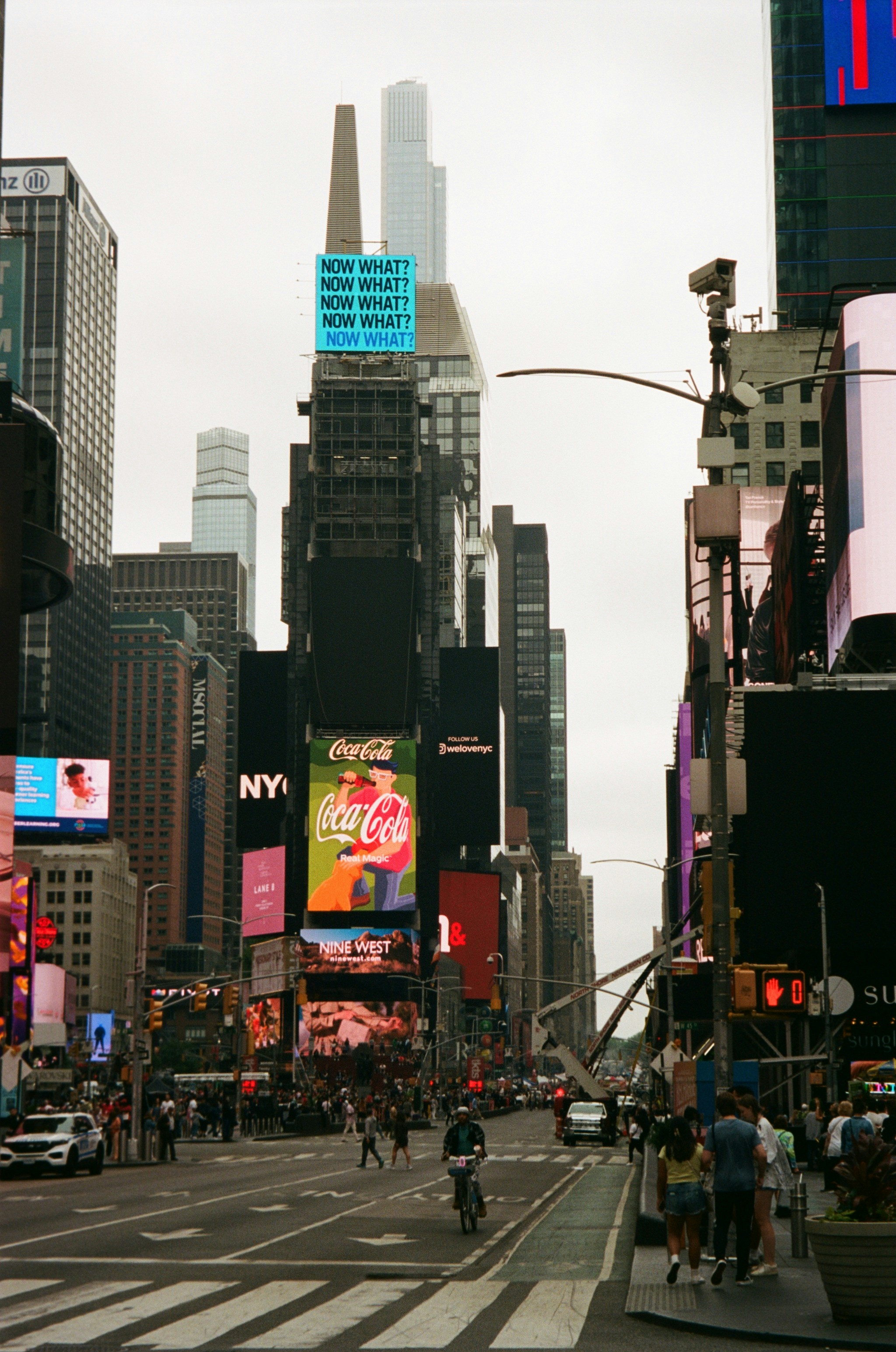 a city street filled with lots of tall buildings