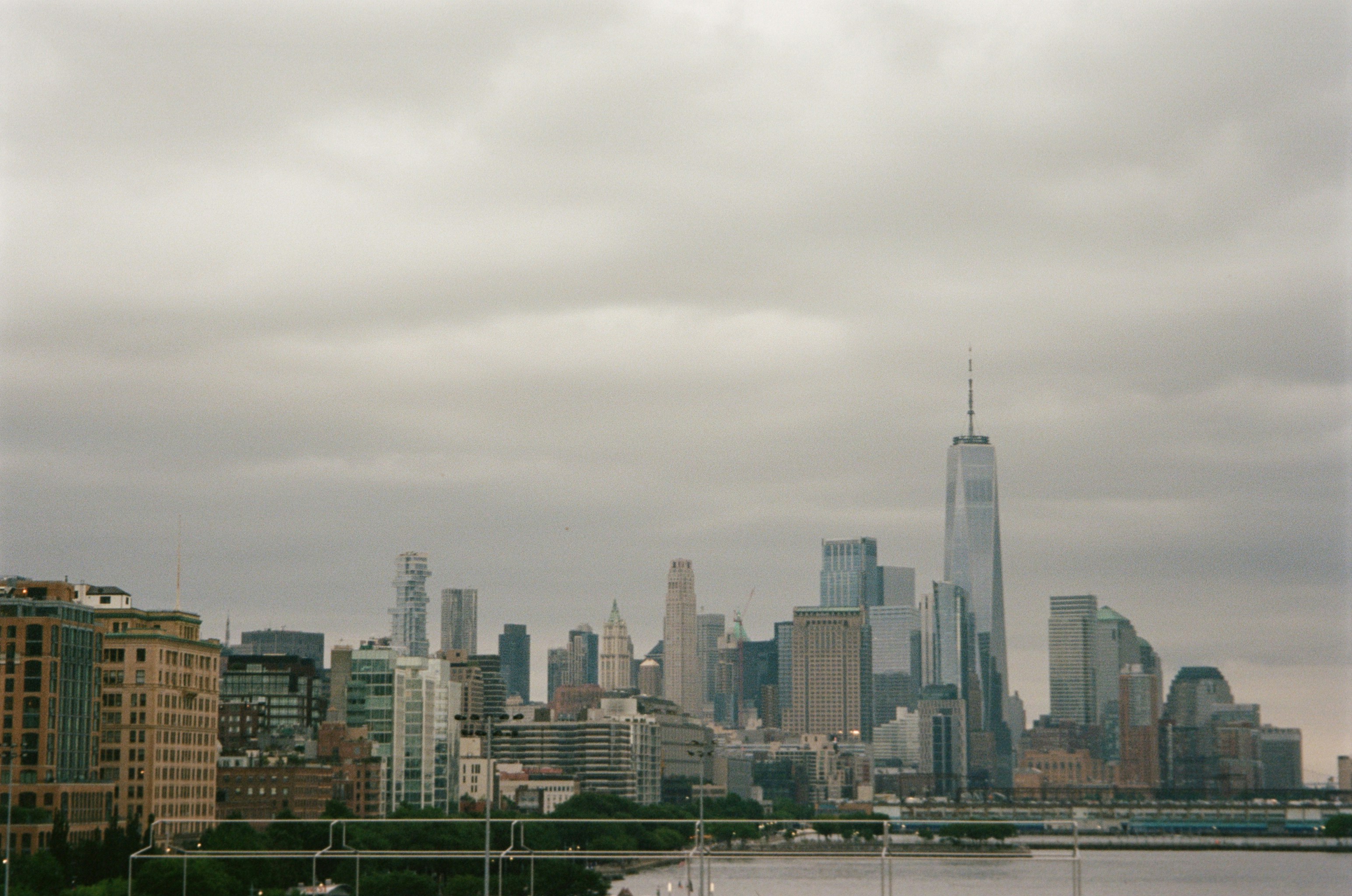 a view of a city skyline with a body of water in the foreground