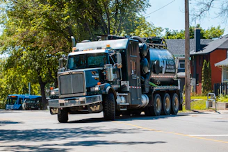 a large truck is driving down the street