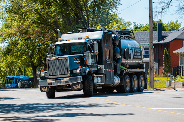 a large truck is driving down the street