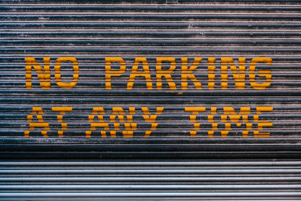 a no parking sign on a garage door