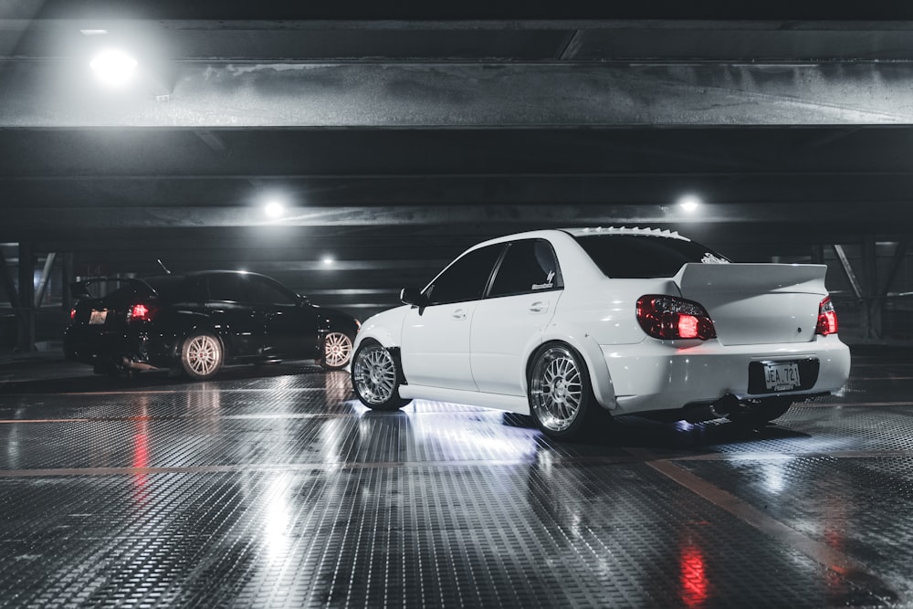 a white car parked in a parking garage