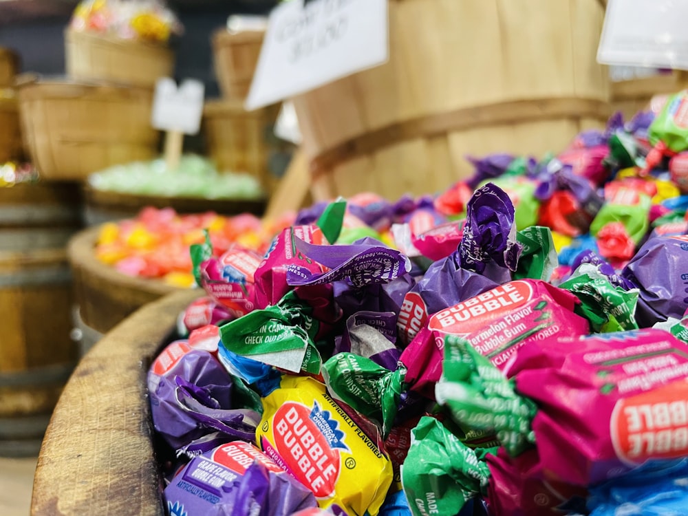 a basket filled with lots of candy sitting on top of a table