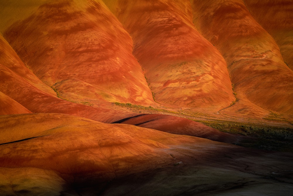 a painting of a desert landscape with hills in the background