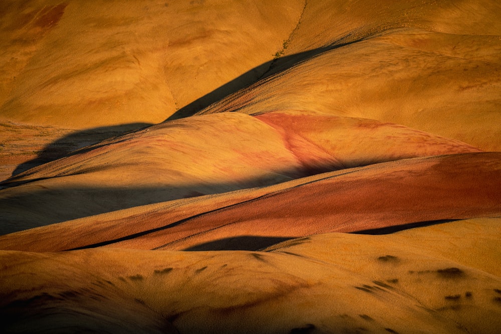 a view of a desert with a few hills in the background