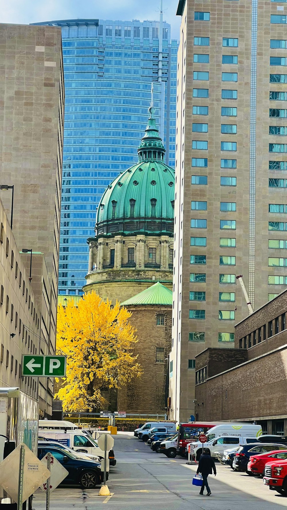 a city street with tall buildings in the background