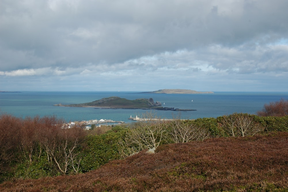 a view of a body of water from a hill