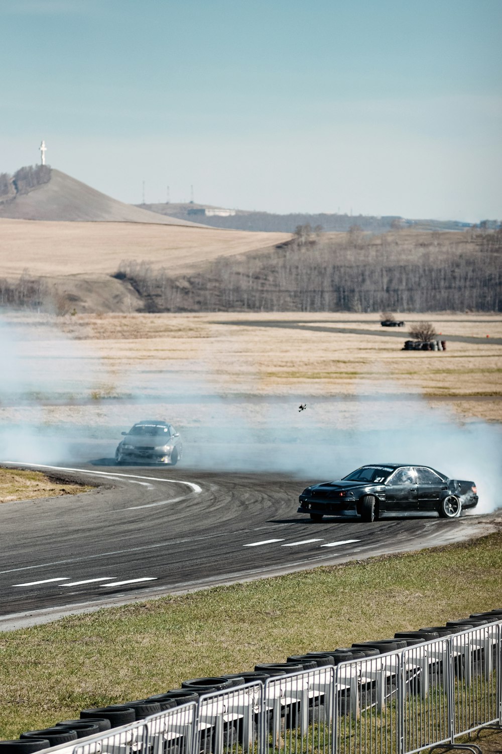 a couple of cars that are on a road