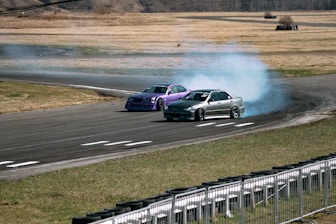 a couple of cars that are on a track