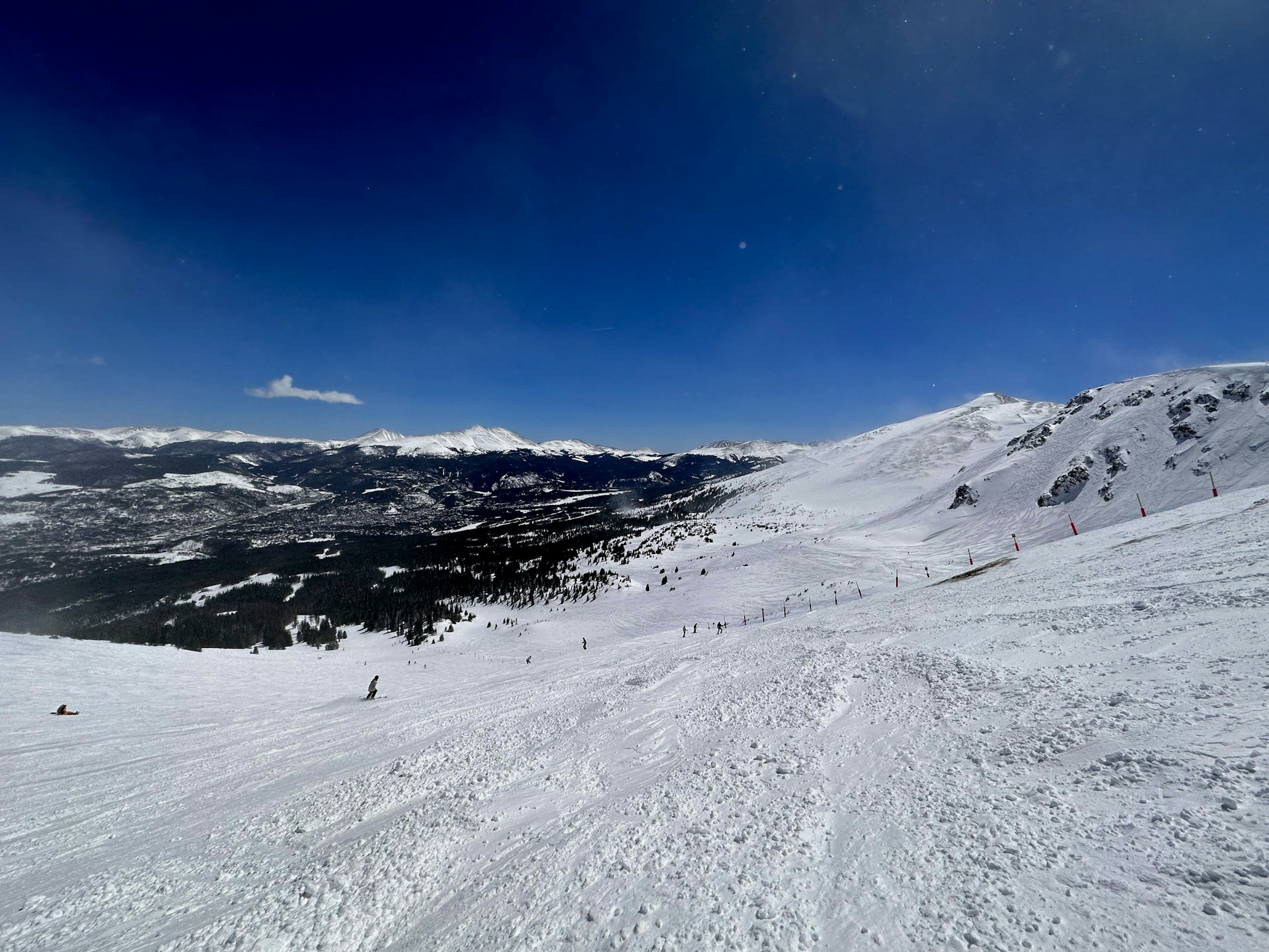 A person riding skis down a snow covered slope