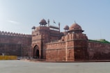 a large brick building with two towers on top of it