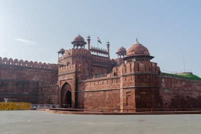 a large brick building with two towers on top of it