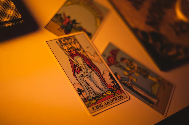 A serene tarot reading setup with golden cards and soft lighting creating a calm atmosphere.