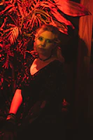 Behind-the-scenes shot of a photoshoot with deep crimson and forest green accents reflecting the agency’s color palette.