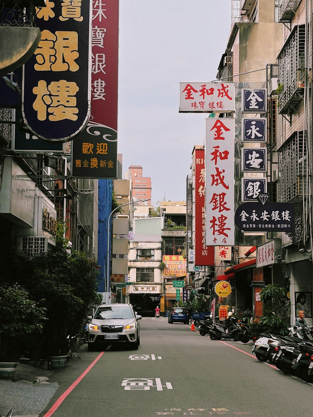 a city street filled with lots of tall buildings