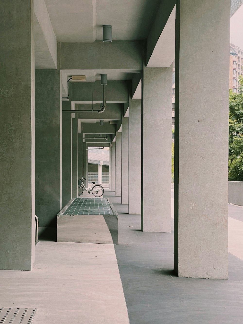 a long hallway with a bike parked on the side of it