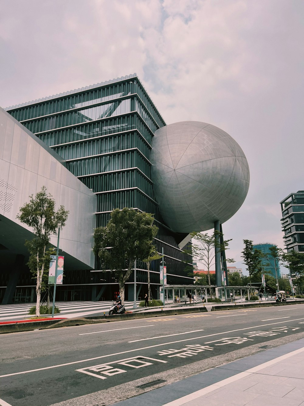 a tall building with a giant ball on top of it