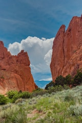 A scenic entrance gate to Valley of Fire State Park with vibrant red rock formations in the background.