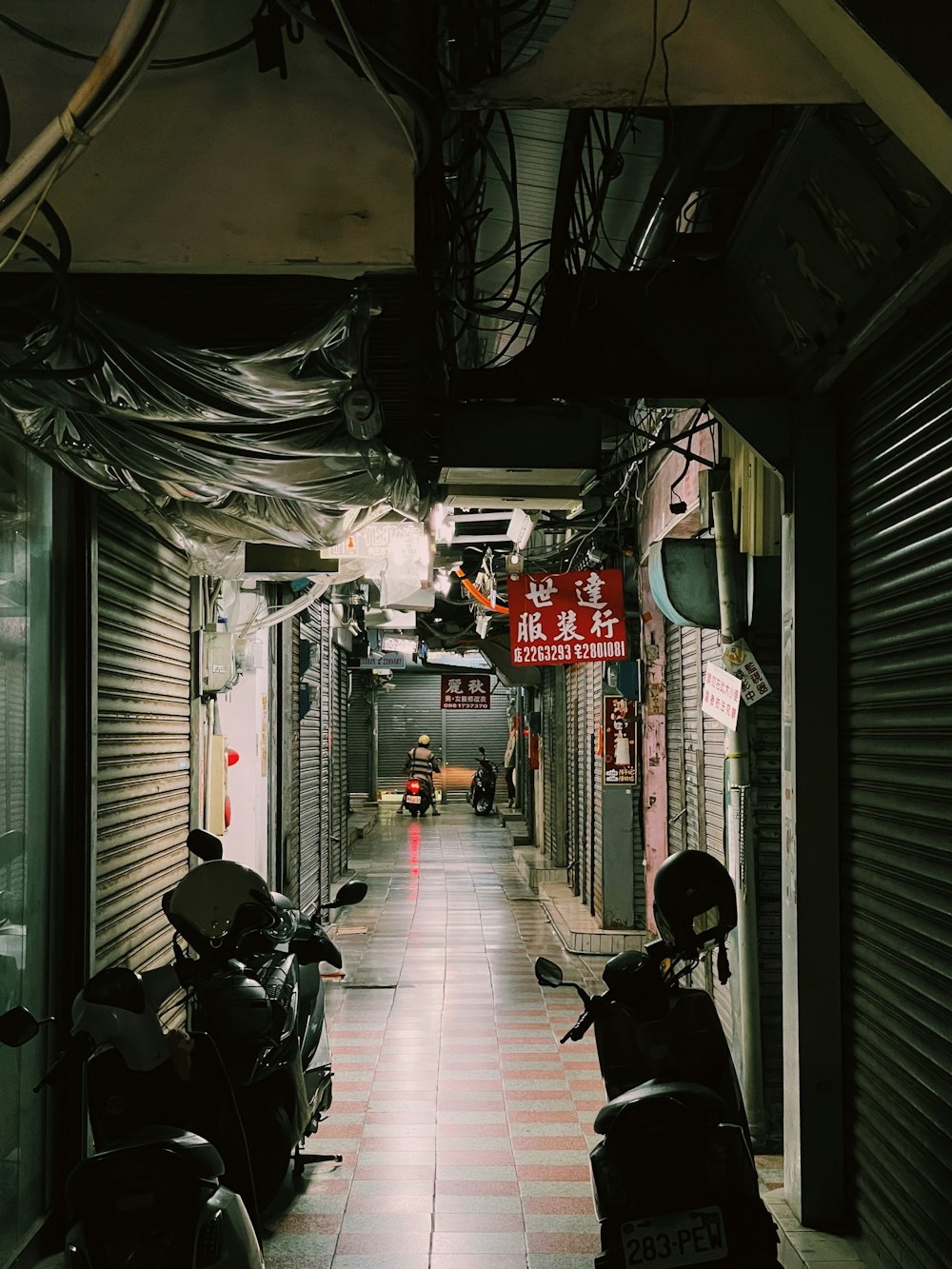 a long hallway with motorcycles parked on the side of it