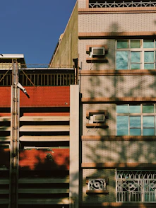 Wide shot of a renovated building facade blending modern and classic elements.