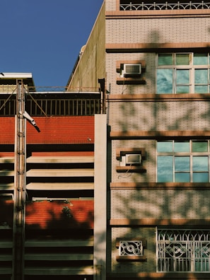 Wide shot of a renovated building facade blending modern and classic elements.