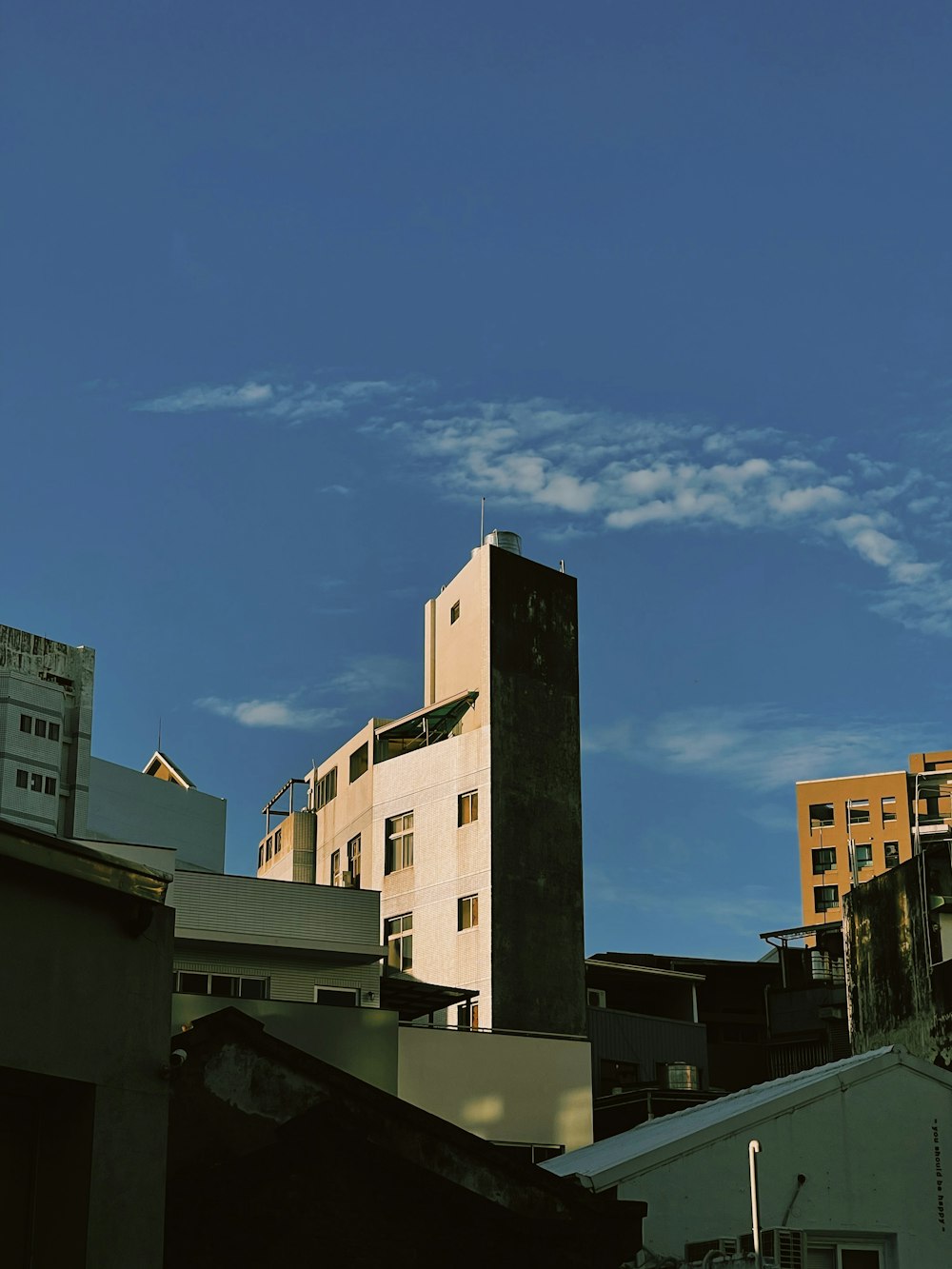 a tall building with a clock on the top of it